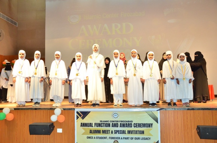 Young girls receiving medals at the Annual Function and Award Ceremony