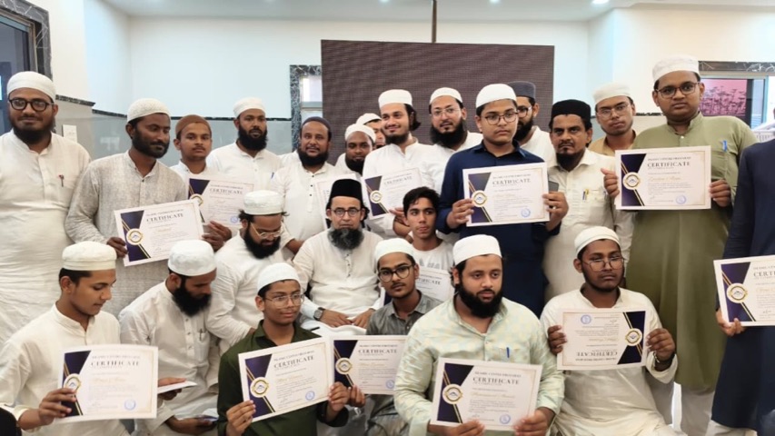 Students holding their Islamic Center course certificates