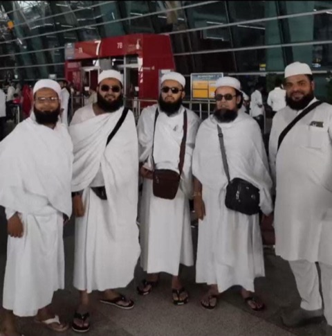 Hajj pilgrims in ihram at the airport before departure