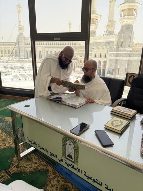 Reading the Qur’an at the Islamic guidance desk overlooking Masjid al-Haram